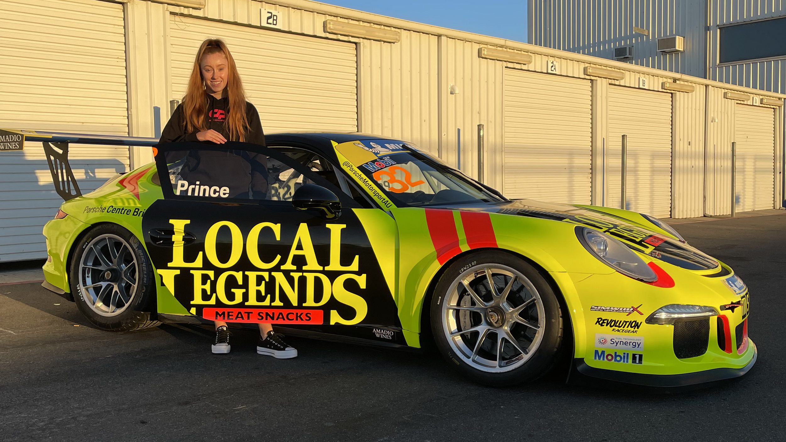 Courtney with her new Local Legends wrapped Porsche GT3.